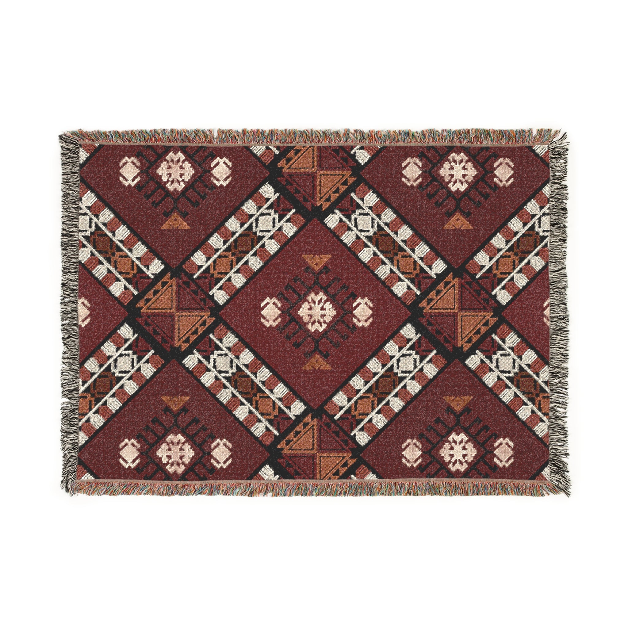 Woven blanket with geometric pattern on a white background

