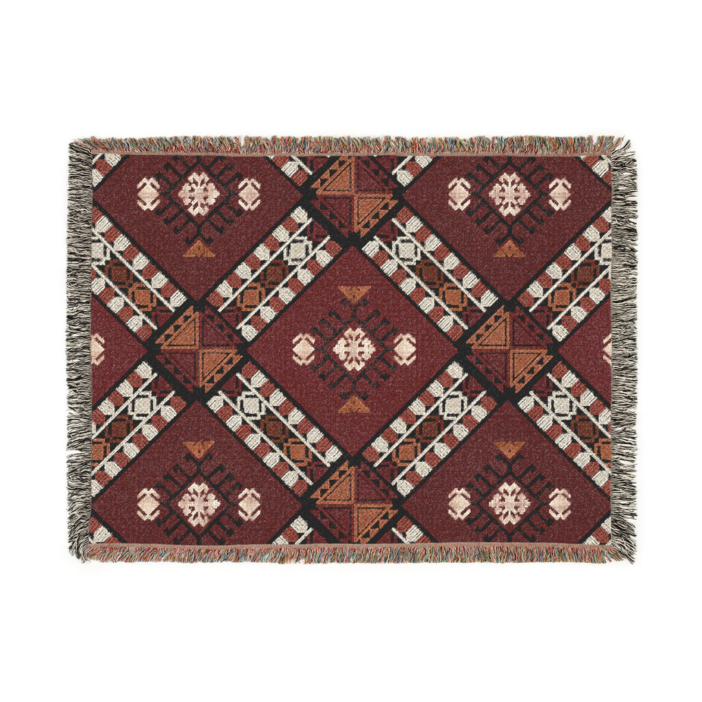Woven blanket with geometric pattern on a white background